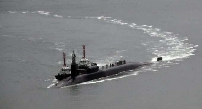 The USS Michigan, an Ohio-class nuclear-powered submarine, arrives at a naval base in Busan