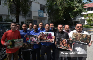 Demonstrasi bantah kekejaman Rohingya dalam hujan