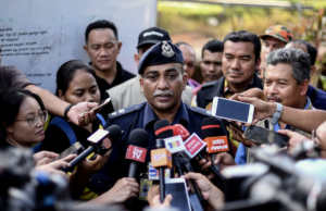 Polis gali kubur Romi Hamdan