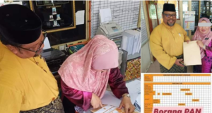 Tarmizi melihat seorang guru mengisi borang keahlian PAN dalam bilik guru sebuah sekolah di Perak Tengah.