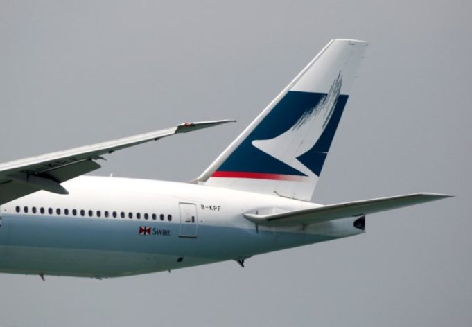 A Cathay Pacific Boeing 777 descends before landing at Hong Kong Airport in Hong Kong