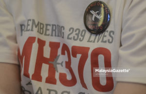 Son of MH370 flight victim seeks answers after 11 years