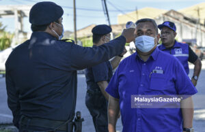 Calon BN nyaris langgar AKPR, tukar baju dalam kereta