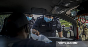 (Picture for representational purposes only) KLIA District Police Chief, Assistant Commissioner Imran Abd Rahman inspects vehicles during a roadblock at Jalan SIC, Salak Tinggi, Selangor, in conjunction with the Movement Control Order (MCO) to curb the spread of Covid-19. PIX: AFFAN FAUZI / MalaysiaGazette/ 02 FEBRUARY 2021. interstate travel send children back to dormitory school no need police approval permit