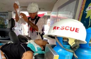 The wounded man is treated in an ambulance in Yangon's Hledan township. PIX: BBC BURMESE