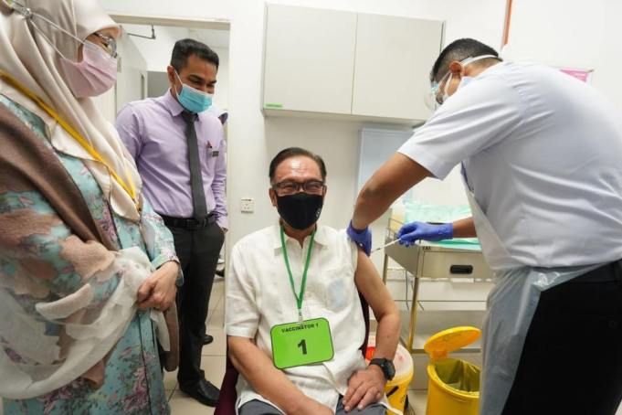 Opposition Chief, Datuk Seri Anwar Ibrahim receives his Covid-19 vaccination shot at the Kuala Lumpur Health Clinic today.