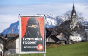 Switzerland has narrowly voted in favour of banning face coverings in public, including the burka or niqab worn by Muslim women. Posters promoted by the Swiss People's Party featured a woman in a black niqab and captions such as "Stop extremism!" and "Stop radical Islam!" PIX: EPA via BBC