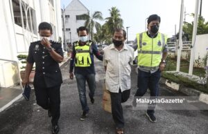 A suspect of the murder case of the IKRAM’s Advocacy Department Manager is charged at the Kajang Court in Selangor. PIX: SYAFIQ AMBAK / MalaysiaGazette / 19 MARCH 2021