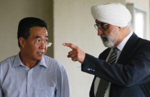 businessman Mun Chol Myong (left) and his lawyer, Jagjit Singh at ther Kuala Lumpur Courts Complex in 2019. PIX: Agensi extradition North Korea US United States America money-laundering Malaysia