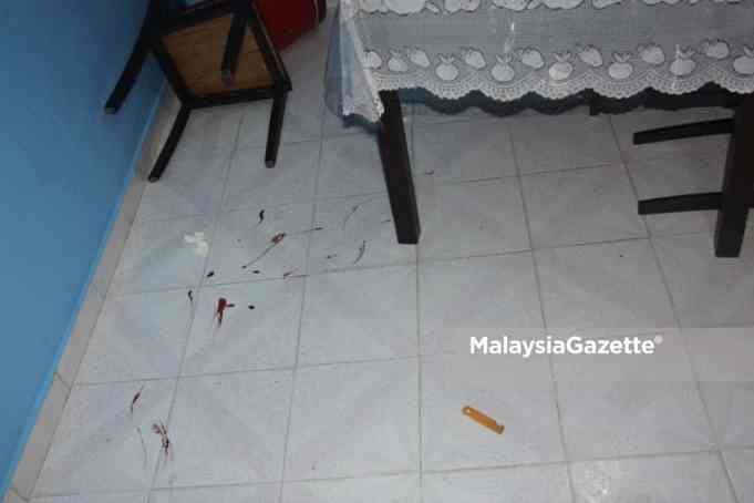 depression The blood stains on the floor of a house after a 17-year-old boy with depression attacked his 60 year-old father with a knife. at Taman Alma Jaya, Bukit Mertajam, Penang,