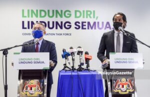 Minister of Health Datuk Seri Dr Adham Baba (left) and the Minsiter of Science, Technology and Innovation cum the Coordinating Minister of the National Covid-19 Immunisation Programme (PICK), Khairy Jamaluddin Abu Bakar at a joint-news conference full scale MCO Selangor