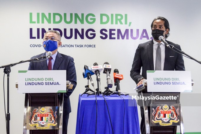 Minister of Health Datuk Seri Dr Adham Baba (left) and the Minsiter of Science, Technology and Innovation cum the Coordinating Minister of the National Covid-19 Immunisation Programme (PICK), Khairy Jamaluddin Abu Bakar at a joint-news conference full scale MCO Selangor