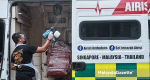 (Picture for representational purposes only). The owner of Raudhah Rich Auto, Mohamad Aries Nordin 39, sanitising an ambulance as an initiative to curb the spread of Covid-19. PIX: MOHD ADZLAN / MalaysiaGazette / 20 MAY 2021.