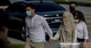 Celebrity cum entrepreneur, Neelofa and her celebrity Islamic preacher Haris Ismail (PU Riz) arrives at the Seremban Courts Complex in Negeri Sembilan to be charged for interstate travel to purchase carpet. PIX: AFFAN FAUZI / MalaysiaGazette / 20 MAY 2021.