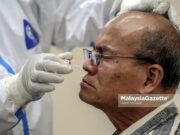 11,034 new Covid-19 cases today Covid-19 cases A resident from the Sri Sabah 3A Public Housing in Kuala Lumpur getting his Covid-19 screening during a Targeted Community Screening Programme. PIX: HAFIZ SOHAIMI /MalaysiaGazette / 05 JUNE 2021