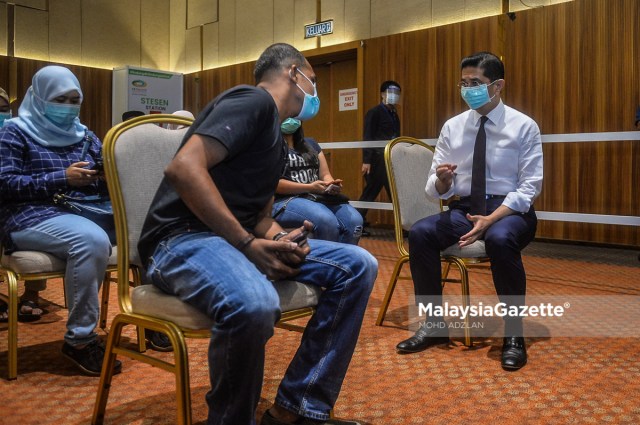 Senior Minister of International Trade and Industry, Datuk Seri Mohamed Azmin Ali meets the recipients of Covid-19 vaccine during his visit to the vaccination centre at the Setia City Convention Centre in Setia Alam, Selangor under the Public-Private Partnership Covid-19 Industry Immunisation (PIKAS) programme.     PIX: MOHD ADZLAN / MalaysiaGazette / 28 JUNE 2021.