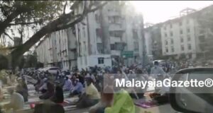 A screenshot showing hundreds of foreigners performing Aidiladha prayer at Taman Pelangi in Juru, Penang.