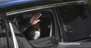 Prime Minister Tan Sri Muhyiddin Yassin waves to the photographers as he leaves his house in Bukit Damansara, Kuala Lumpur. PIX: SYAFIQ AMBAK / MalaysiaGazette / 03 AUGUST 2021.