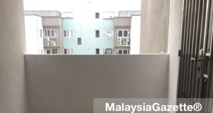 The stool and slippers left behind by the woman who jumped off the 13th floor of Pangsapuri Hijau Indah in Mak Mandin, Penang.