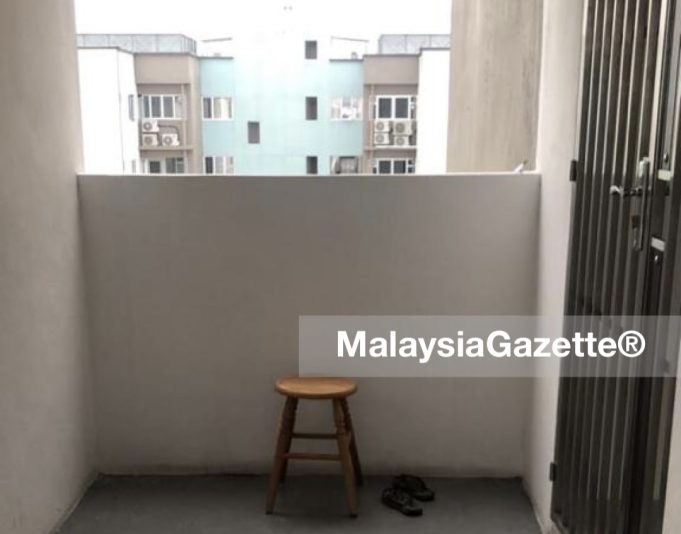 The stool and slippers left behind by the woman who jumped off the 13th floor of Pangsapuri Hijau Indah in Mak Mandin, Penang.