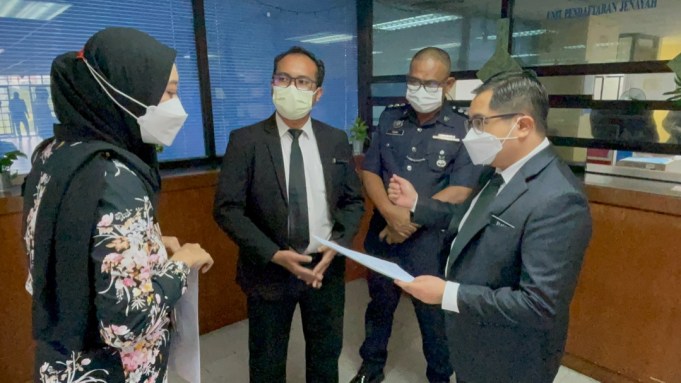 Nurrul Azrina Arza (left) and Deputy Public Prosecutor, Muhammad Syafiq Mohd Ghazali (right) files an appeal notice on the acquittal of a salesgirl from dangerous driving and causing the death of eight teen joyride cyclists four years ago Sam Ke Ting