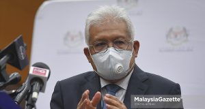 Edisi Siasat Home Minister Datuk Seri Hamzah Zainudin at a news conference after the Foreign Workers Management Committee Meeting at the Ministry of Human Resources, Putrajaya. PIX: SYAFIQ AMBAK / MalaysiaGazette /26 OCTOBER 2021 Telegram corruption