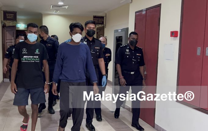 construction worker Bangladeshi murder girlfriend killing Indonesian woman Apartment Sri Nipah Kamruzzaman (blue shirt) was charged with the murder of his girlfriend at the George Town Magistrate Court today.