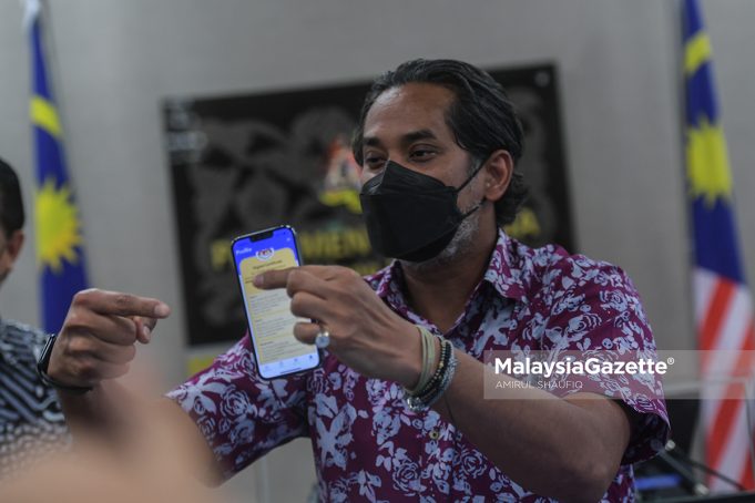 Khairy Jamaluddin Covid-19 vaccination status vaccine defamation suit Lokman Adam Ustaz Abu Syafiq