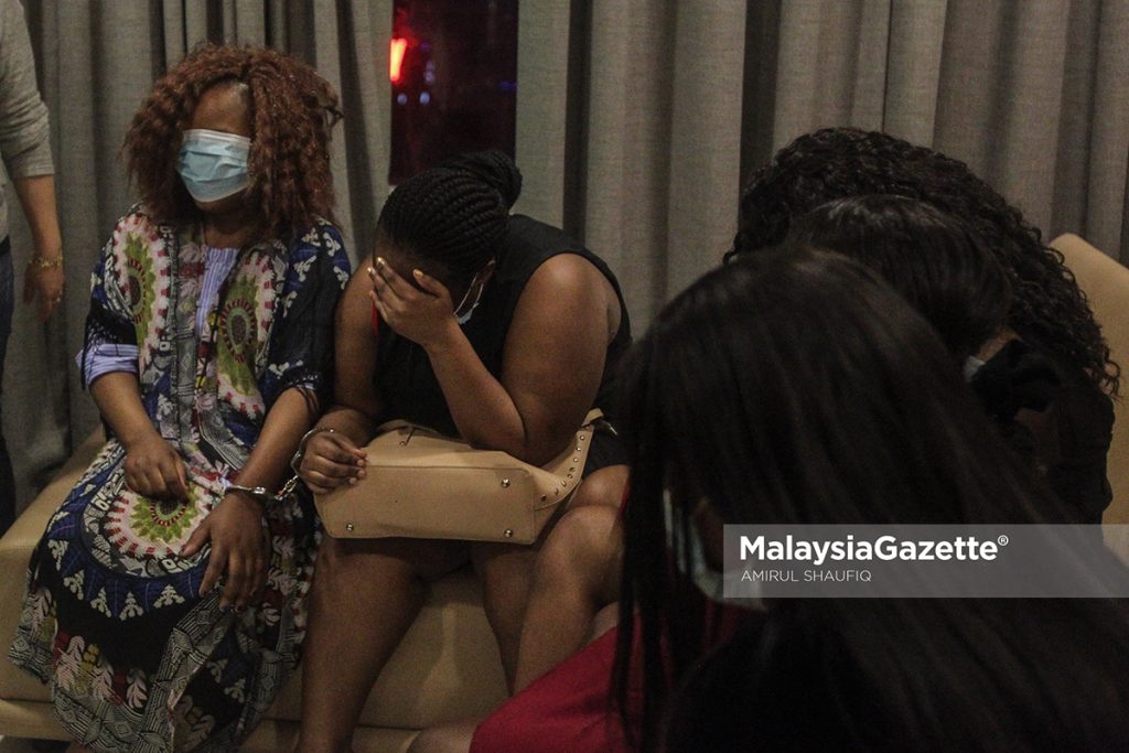    Among the African students arrested for prostitution at Plantinum Suites, Kuala Lumpur, during and raid by the Department of Immigration.     PIX: AMIRUL SHAUFIQ / MalaysiaGazette /07 JANUARY 2022.