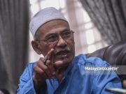 Rosli Sidek, the grandfather to the Danial Iskandar, the teenager who stole money from a mosque. PIX: MOHD ADZLAN / MalaysiaGazette / 14 JANUARY 2022. shower bathed corpse mortuary bathroom waterboarding Al Islahiah Kuang Mosque
