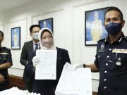 fake Covid-19 vaccine cert Dr Kasemani Embong Rohaimi Bin Md Isa and showing the fake Covid-19 vaccination certifications seized from a private clinic in Terengganu today.