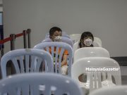 Children waiting for their turn to get their Covid-19 vaccine in conjunction with the National Covid-19 Immunisation Programme for Kids (PICKids) at the Axiata Arena Bukit Jalil, Kuala Lumpur. PIX: AMIRUL SHAUFIQ / MalaysiaGazette / 03 FEBRUARY 2022