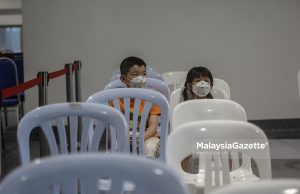 Children waiting for their turn to get their Covid-19 vaccine in conjunction with the National Covid-19 Immunisation Programme for Kids (PICKids) at the Axiata Arena Bukit Jalil, Kuala Lumpur. PIX: AMIRUL SHAUFIQ / MalaysiaGazette / 03 FEBRUARY 2022