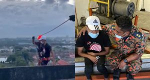 Firefighters saving a man who tried to jump off 18th floor of an apartment at Section U2, Shah Alam early this morning. PIX: Fire and Rescue Department
