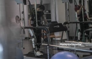 A patient undergoing physiotherapy using the Robot Suit Hybrid Assistive Limb at the Tun Abdul Razak PERKESO Rehabilitation Centre, Melaka. PIX: AMIRUL SHAUFIQ / MalaysiaGazette / 28 MARCH 2022