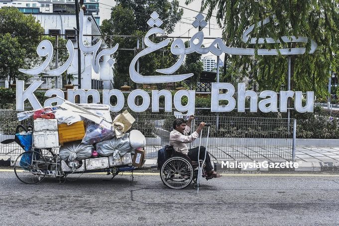 Affendi Muda, a homeless person with disabilities (PWD) in his wheelchair and crutches makes a living by scavenging and selling recycled items around Kuala Lumpur. PIX: AMIRUL SHAUFIQ / MalaysiaGazette / 12 APRIL 2022