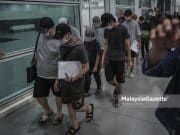 12 Malaysians who were tricked by job scam in Cambodia arrive safely at the Kuala Lumpur International Airport 2 (KLIA2) after they were rescued by the Cambodian Police and the Royal Malaysia Police (PDRM) through the INTERPOL, ASEANAPOL and the Ministry of Foreign Affairs. PIX: HAZROL ZAINAL / MalaysiaGazette / 12 APRIL 2022.