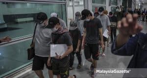 12 Malaysians who were tricked by job scam in Cambodia arrive safely at the Kuala Lumpur International Airport 2 (KLIA2) after they were rescued by the Cambodian Police and the Royal Malaysia Police (PDRM) through the INTERPOL, ASEANAPOL and the Ministry of Foreign Affairs. PIX: HAZROL ZAINAL / MalaysiaGazette / 12 APRIL 2022.