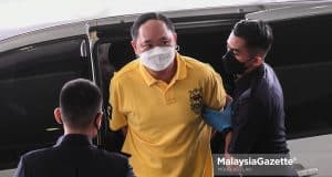 The accused is charged with owning luxury vehicles from the proceeds of money-laundering and unlawful activities at the Shah Alam Sessions Court. PIX: MOHD ADZLAN / MalaysiaGazette / 13 APRIL 2022 Chung Chee Yong unlawful activities money-laundering proceeds