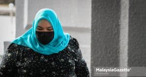 The Founder of Rumah Bonda, Siti Bainun Ahd. Razali arrives at the Kuala Lumpur Court Complex for her proceeding on child neglect and abuse of the 13-year-old Down Syndrome girl, Bella. PIX: MUHD NA'IM / MalaysiaGazette /15 APRIL 2022.