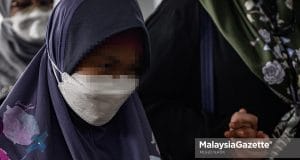 Down Syndrome girl, Bella arrives at the Kuala Lumpur Court Complex for the identification session of three witnesses in her neglect and abuse trial involving the founder of Rumah Bonda, Siti Bainun Ahd Razali. PIX: MUHD NA'IM / MalaysiaGazette / 17 JUNE 2022.