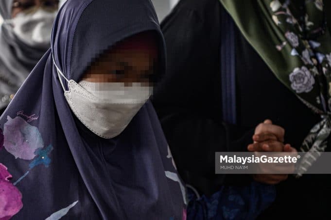 Down Syndrome girl, Bella arrives at the Kuala Lumpur Court Complex for the identification session of three witnesses in her neglect and abuse trial involving the founder of Rumah Bonda, Siti Bainun Ahd Razali. PIX: MUHD NA'IM / MalaysiaGazette / 17 JUNE 2022.