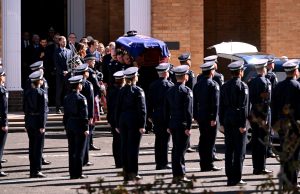 Australia posts reward for arrest of gunman after police killings
