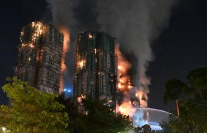 Fire engulfs Hong Kong residential blocks, killing at least 13