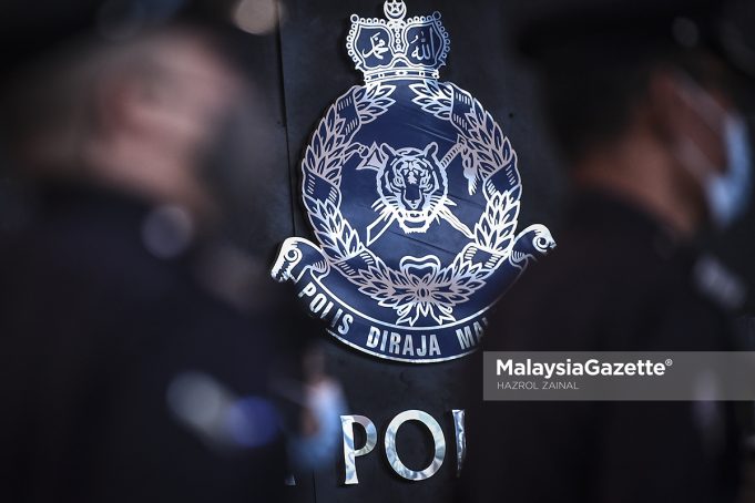 Logo Polis di Kuala Lumpur. Foto HAZROL ZAINAL, 25 MAC 2021.