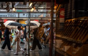 Four injured, flights cancelled in Japan as twin storms approach