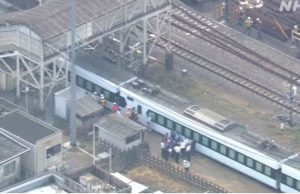 Japan train hits station workers, killing four